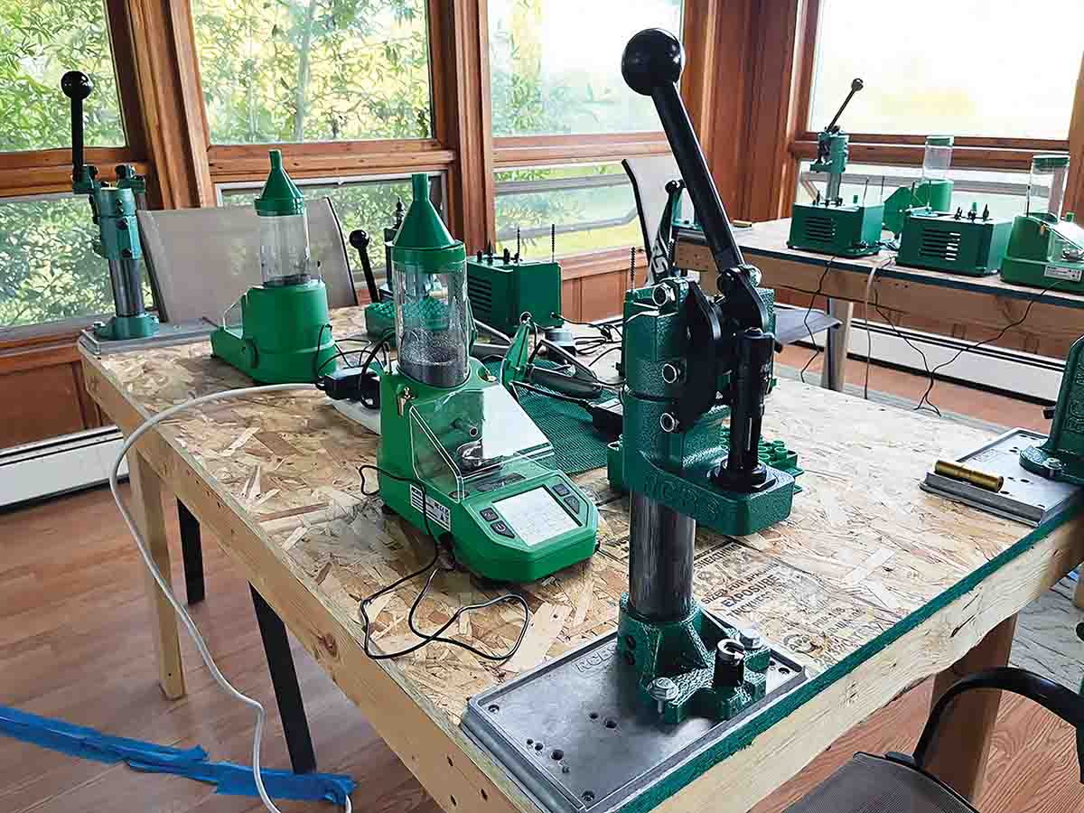 A temporary, multiple handloading setup. RCBS base plates provide solid attachments for anything from a bench priming tool to a maximum torque-loading press.